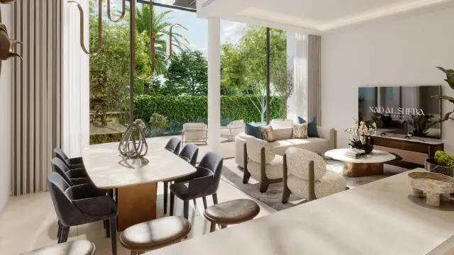 Open-plan dining and living area facing the garden